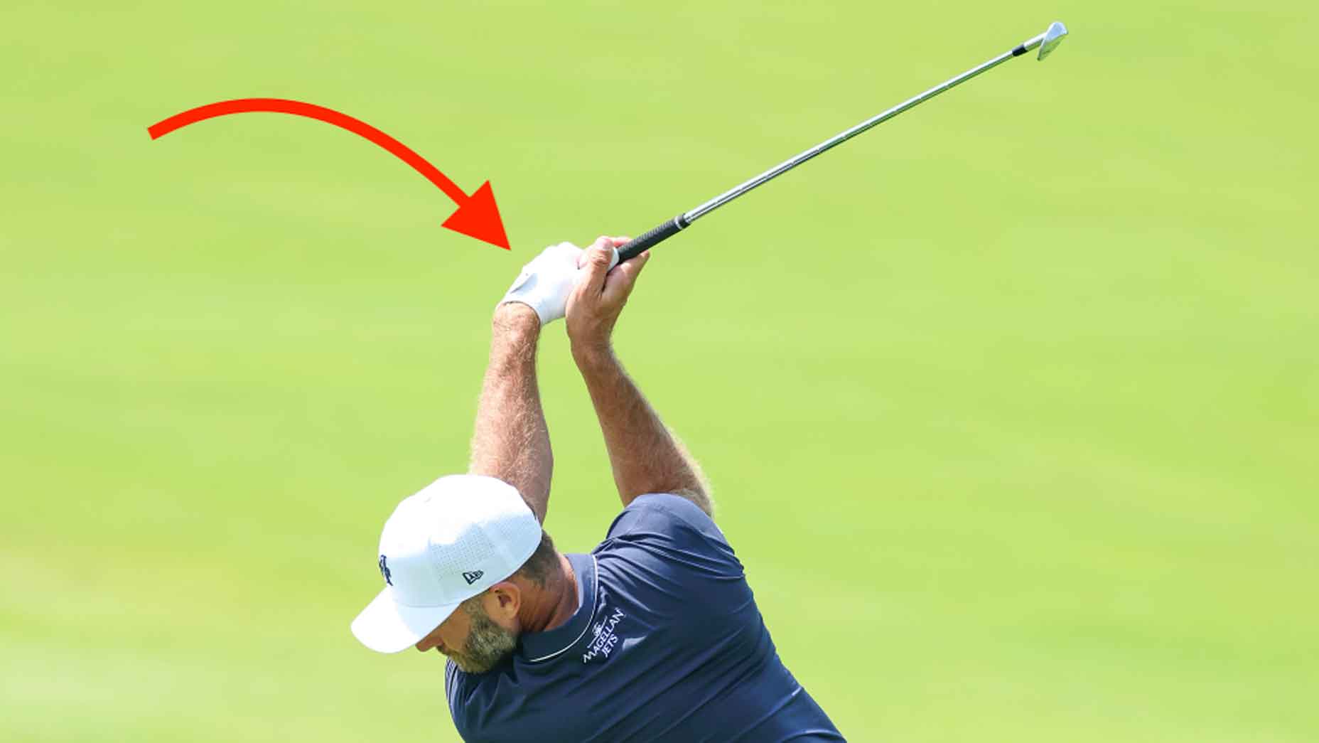 dustin johnson swings golf club with bowed lead wrist